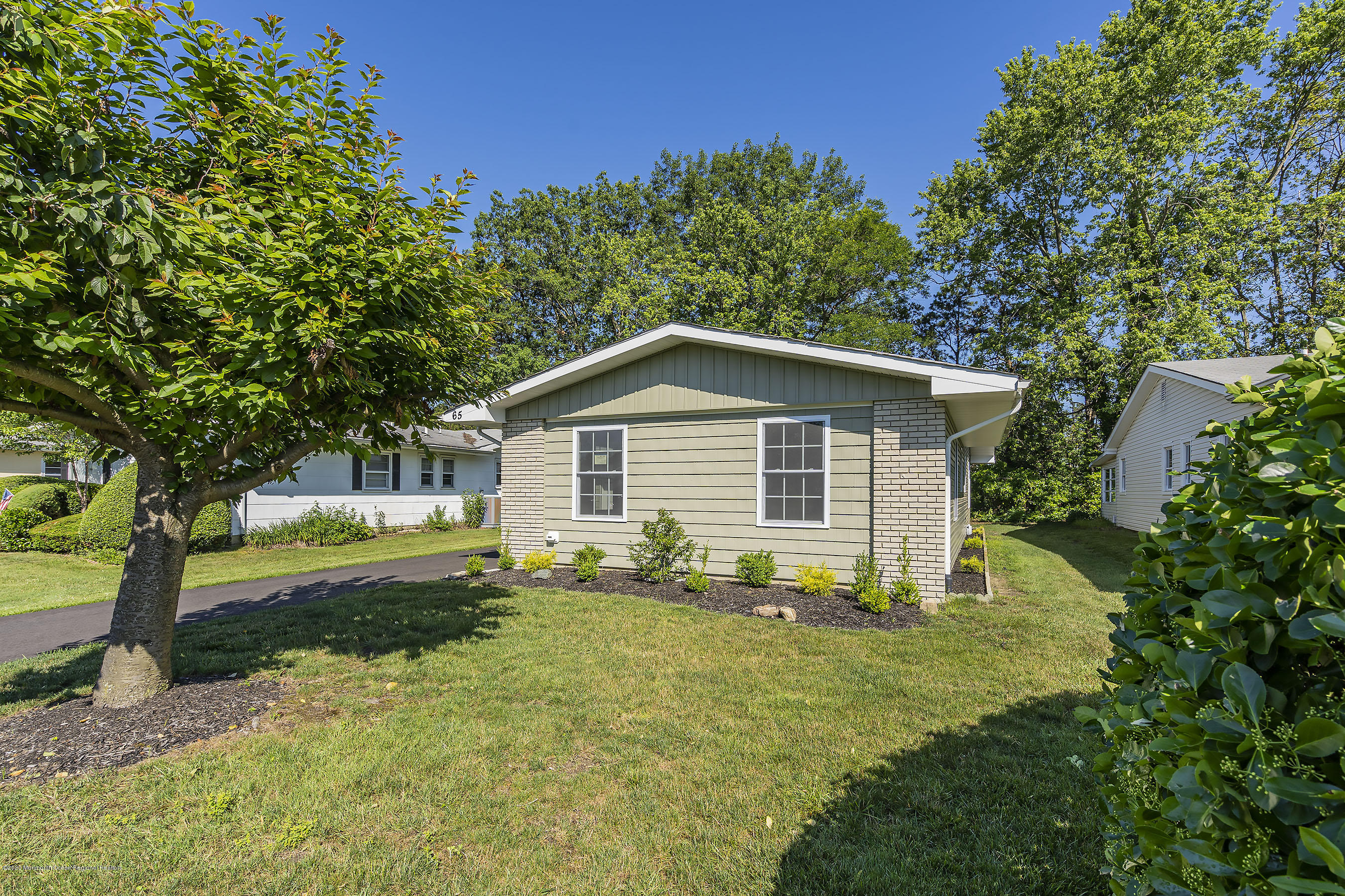 65 Markham Road Brick, NJ 08724 - Photo 2 of 27 a view of backyard of house with green space