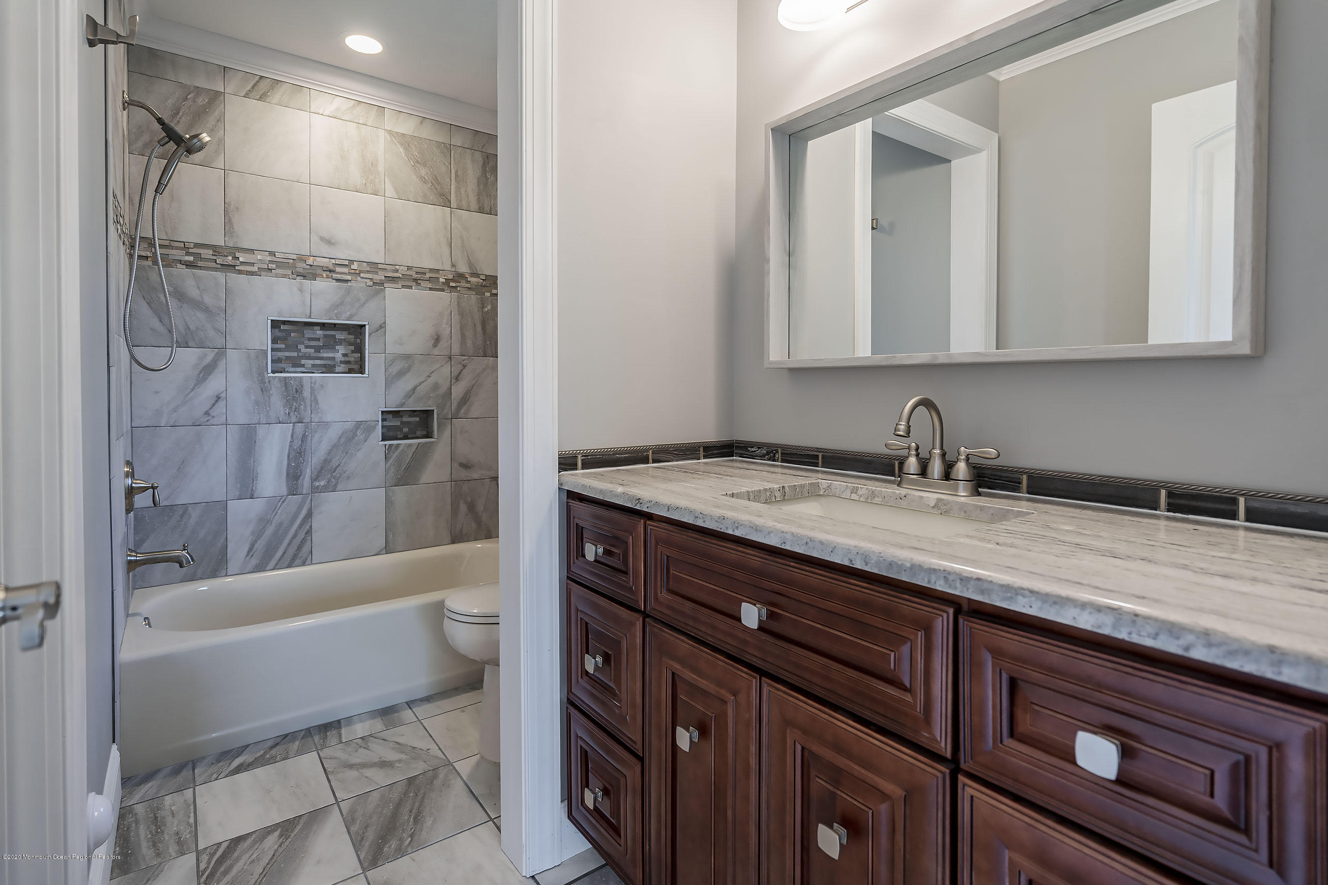 65 Markham Road Brick, NJ 08724 - Photo 21 of 27 a bathroom with a granite countertop sink a toilet and bathtub