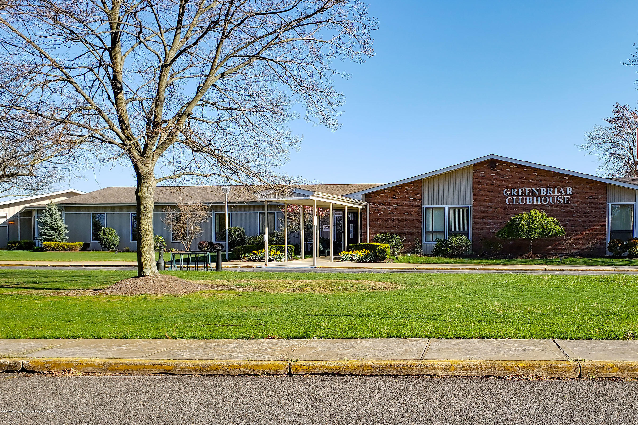 65 Markham Road Brick, NJ 08724 - Photo 26 of 27 a view of a big building with a big yard and large trees