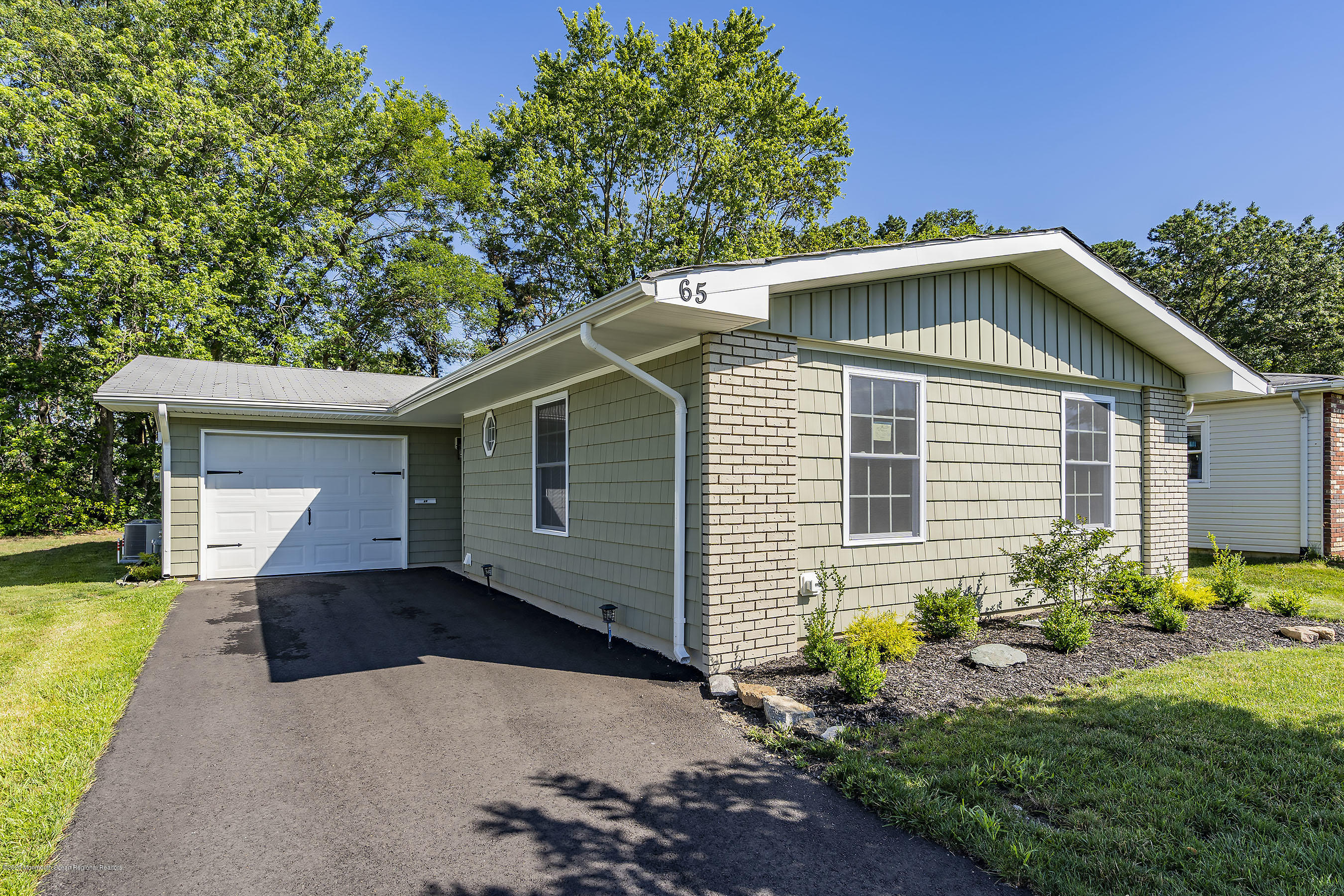 65 Markham Road Brick, NJ 08724 - Photo 27 of 27 a front view of a house with a yard