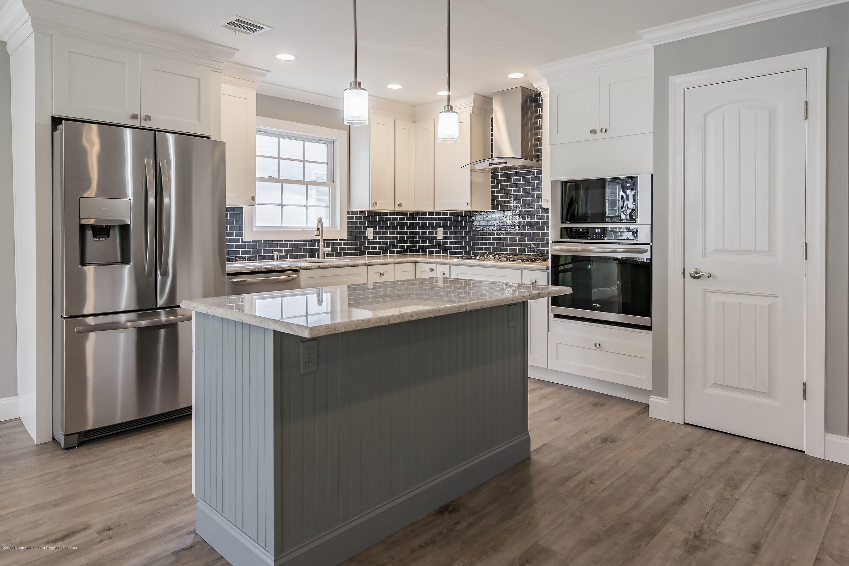 65 Markham Road Brick, NJ 08724 - Photo 5 of 27 a kitchen with stainless steel appliances granite countertop a refrigerator a stove a sink and a microwave