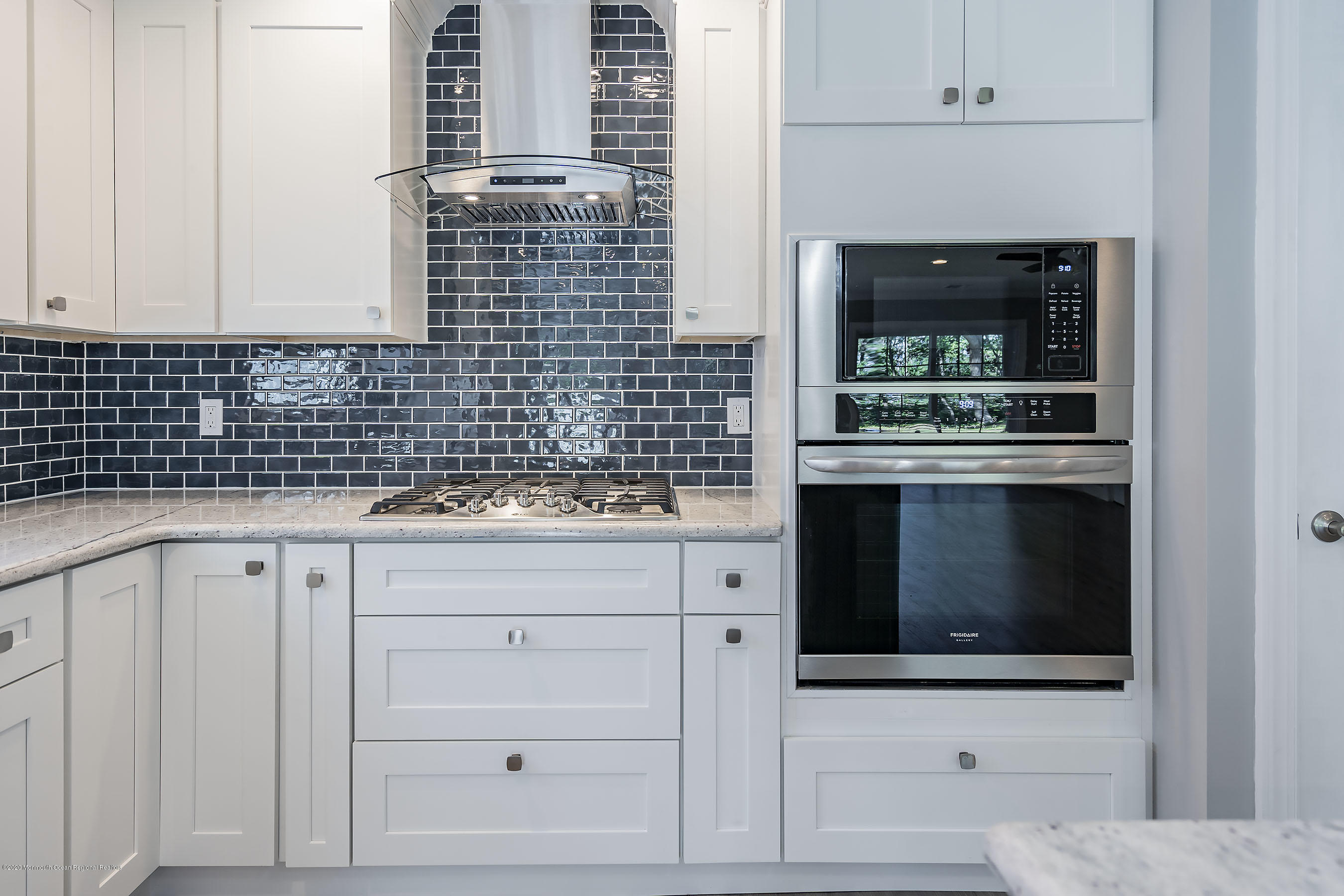 65 Markham Road Brick, NJ 08724 - Photo 7 of 27 a kitchen with granite countertop white cabinets and appliances
