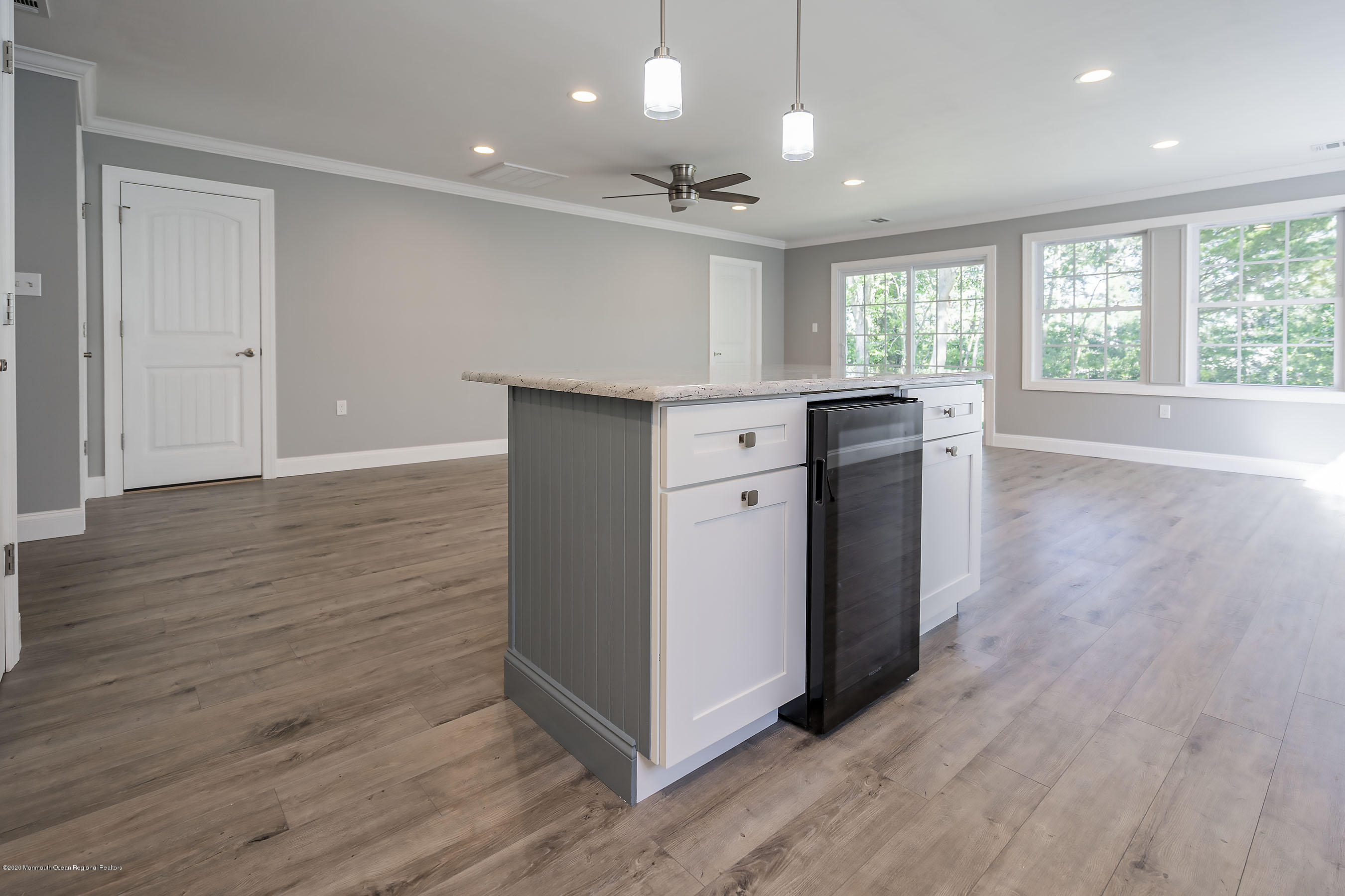 65 Markham Road Brick, NJ 08724 - Photo 10 of 27 a view of kitchen with wooden floor and window