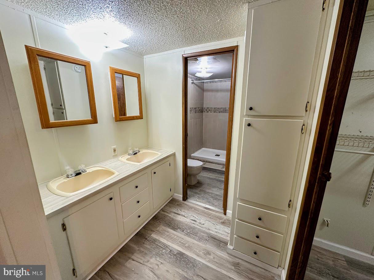 19 Gordon Drive Dover, DE 19901 - Photo 13 of 19 a bathroom with 2 sink tub and a mirror