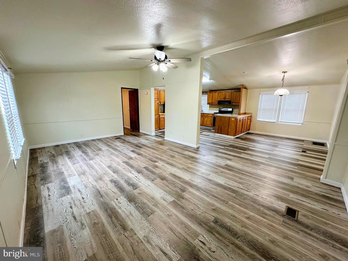 19 Gordon Drive Dover, DE 19901 - Photo 3 of 19 a view of a livingroom with a ceiling fan wooden floor and a ceiling fan