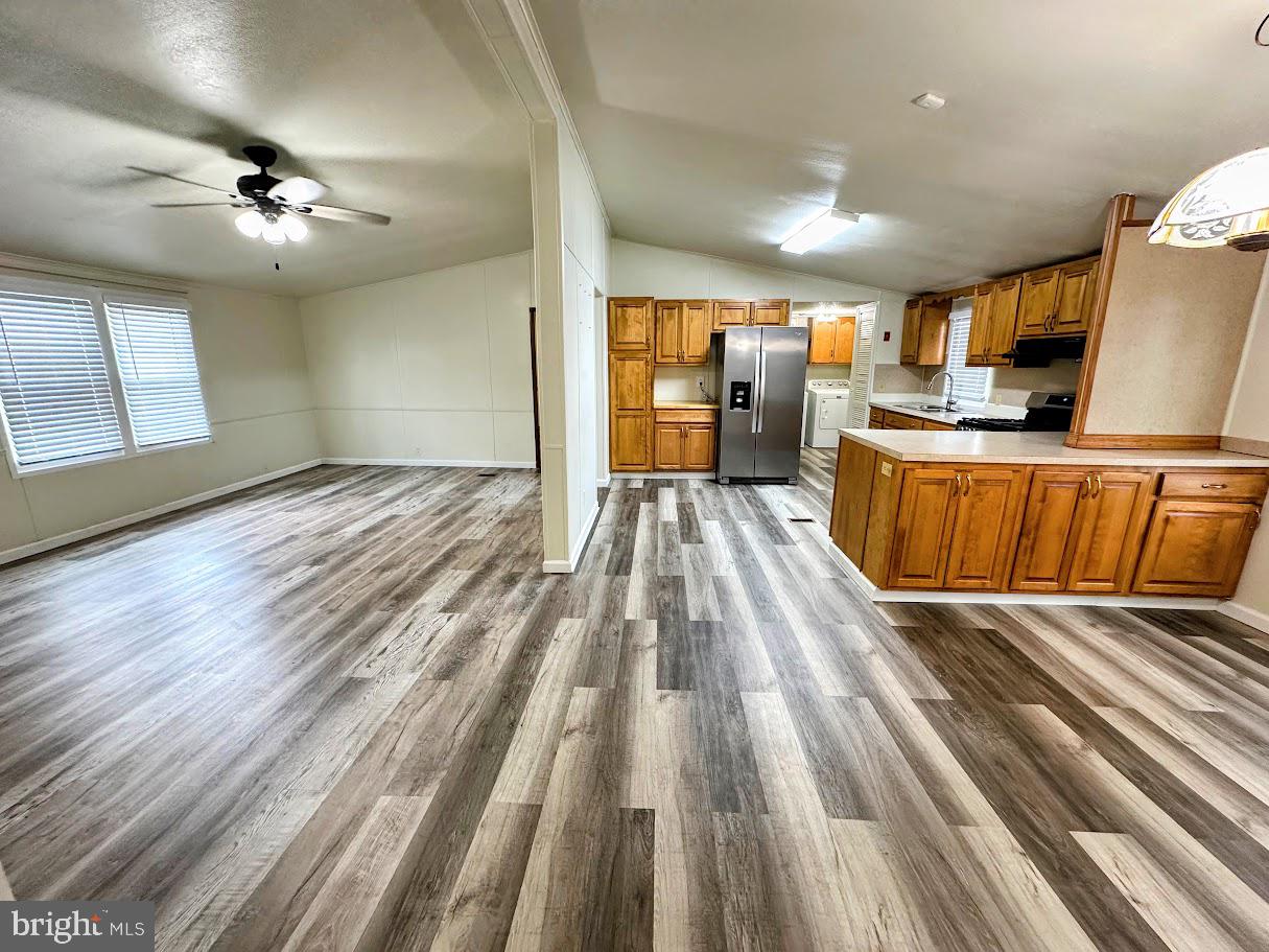 19 Gordon Drive Dover, DE 19901 - Photo 4 of 19 a view of kitchen with sink microwave and stove