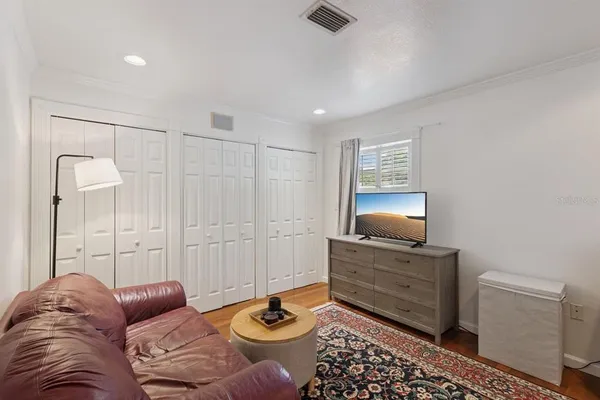 a living room with furniture and a lamp