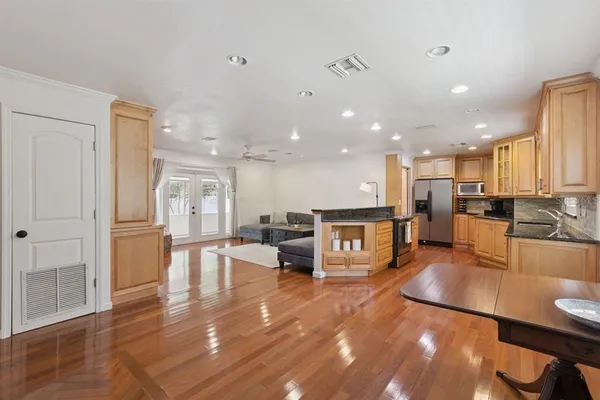 a lobby with furniture and wooden floor