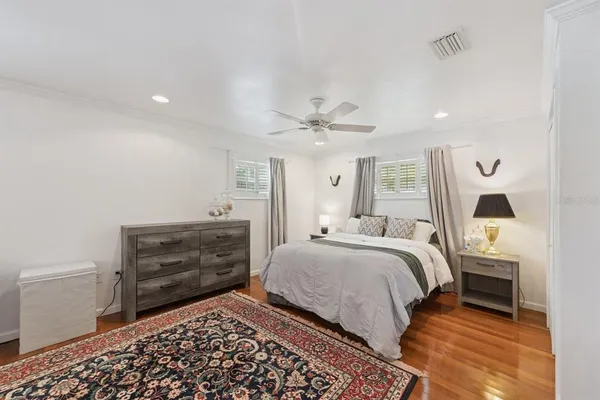 a bedroom with a bed and cabinets