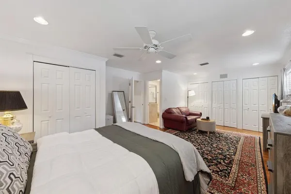 a bedroom with a bed and a couch