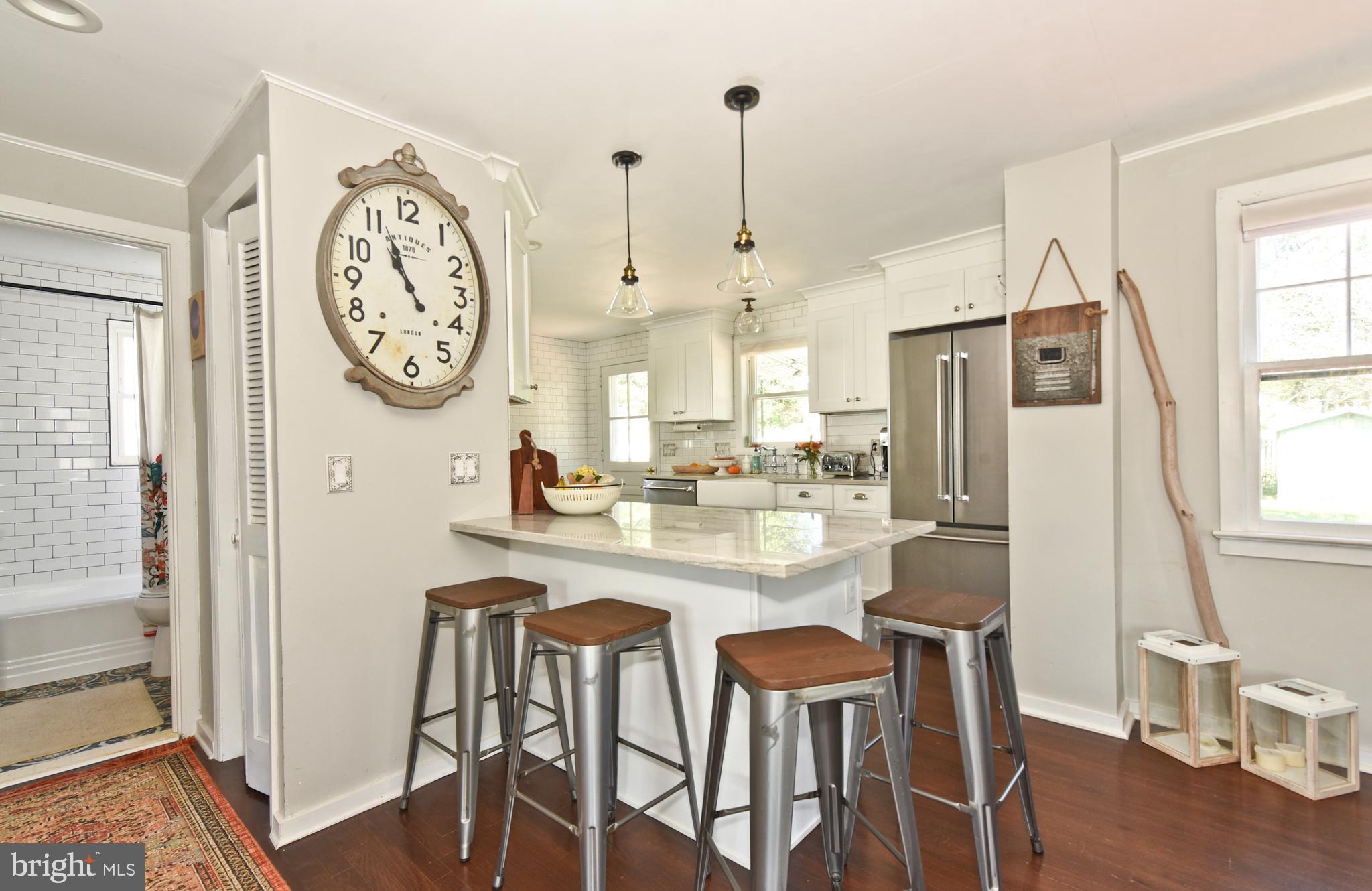 132 Roxboro Road Trenton, NJ 08648 - Photo 9 of 25 View o breakfast bar into kitchen