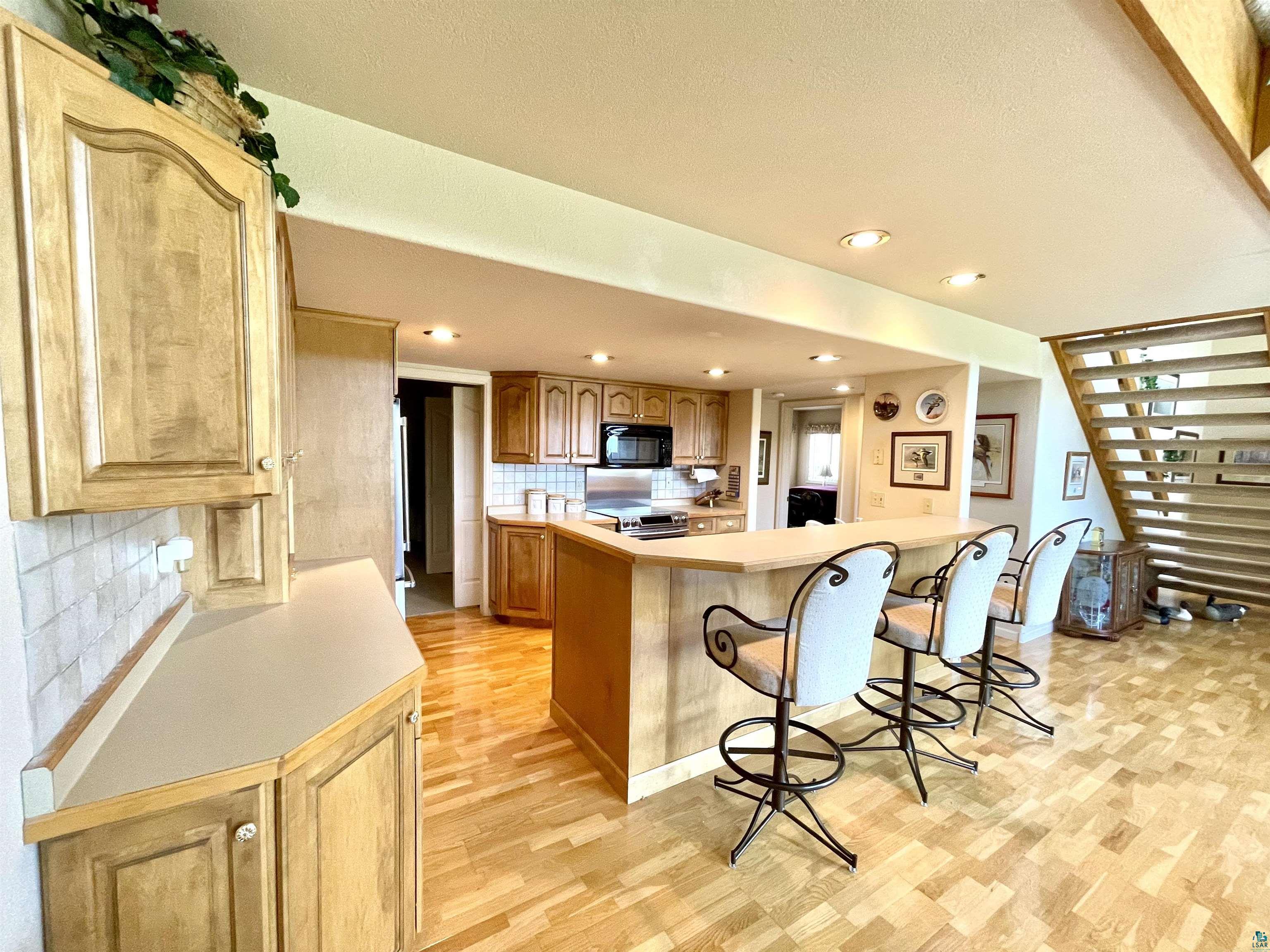 183 Cramer Road Schroeder, MN 55613 - Photo 16 of 50 Kitchen with breakfast bar.