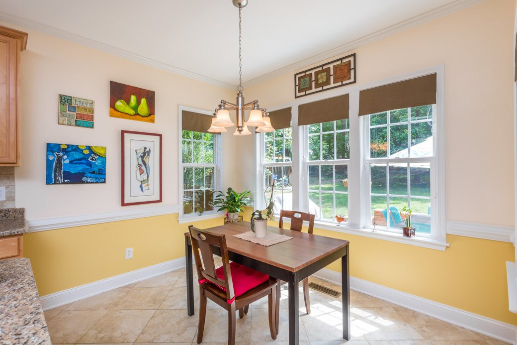 7604 Rambeau Circle Raleigh, NC 27613 - Photo 11 of 25 The kitchen and the breakfast room have tile flooring and there's a stunning view into the back yard oasis! Enjoy your coffee in the morning in this room. Breakfast Room