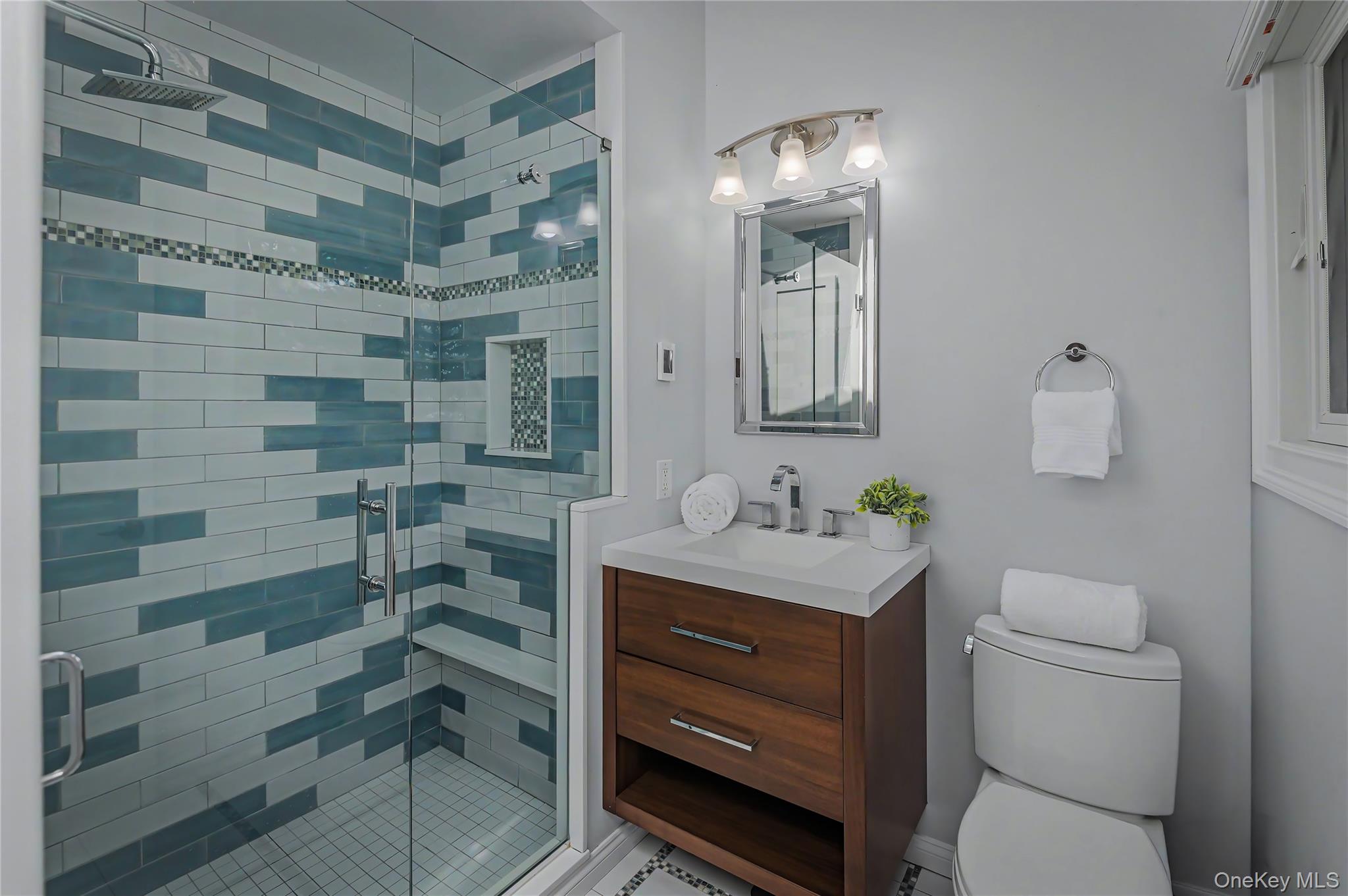 41 Cross Pond Road Pound Ridge, NY 10576 - Photo 26 of 41 a bathroom with a toilet a sink and mirror