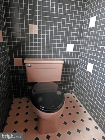 a utility room with cabinets washer and dryer
