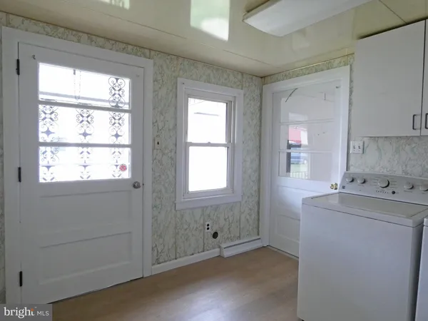 a view of empty room with windows