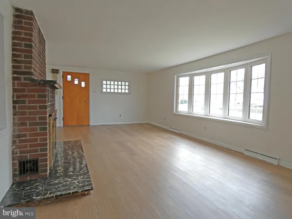 a view of a livingroom with wooden floor
