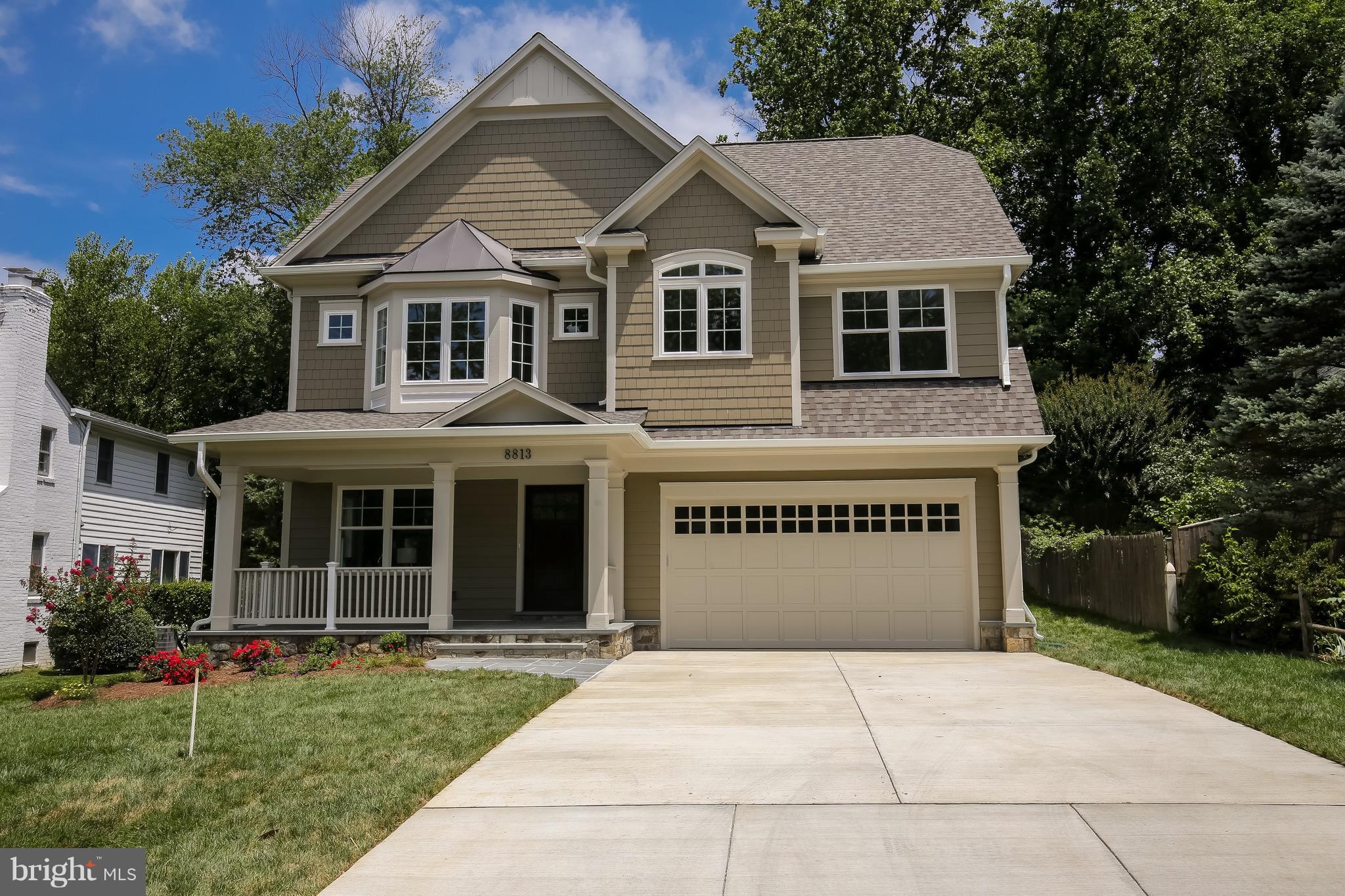 8813 Ridge Road Bethesda, MD 20817 - Photo 1 of 30 a front view of a house with a yard