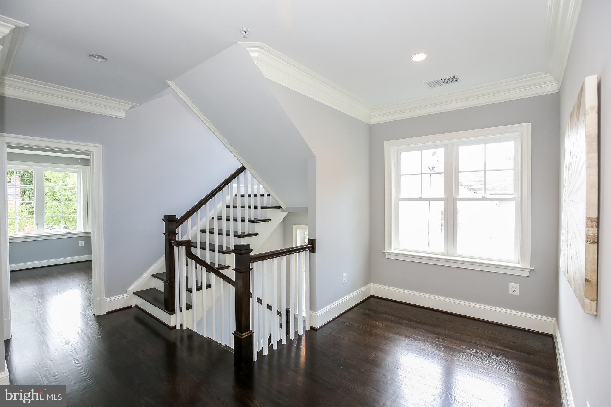 8813 Ridge Road Bethesda, MD 20817 - Photo 12 of 30 a view of entryway with wooden floor and stairs