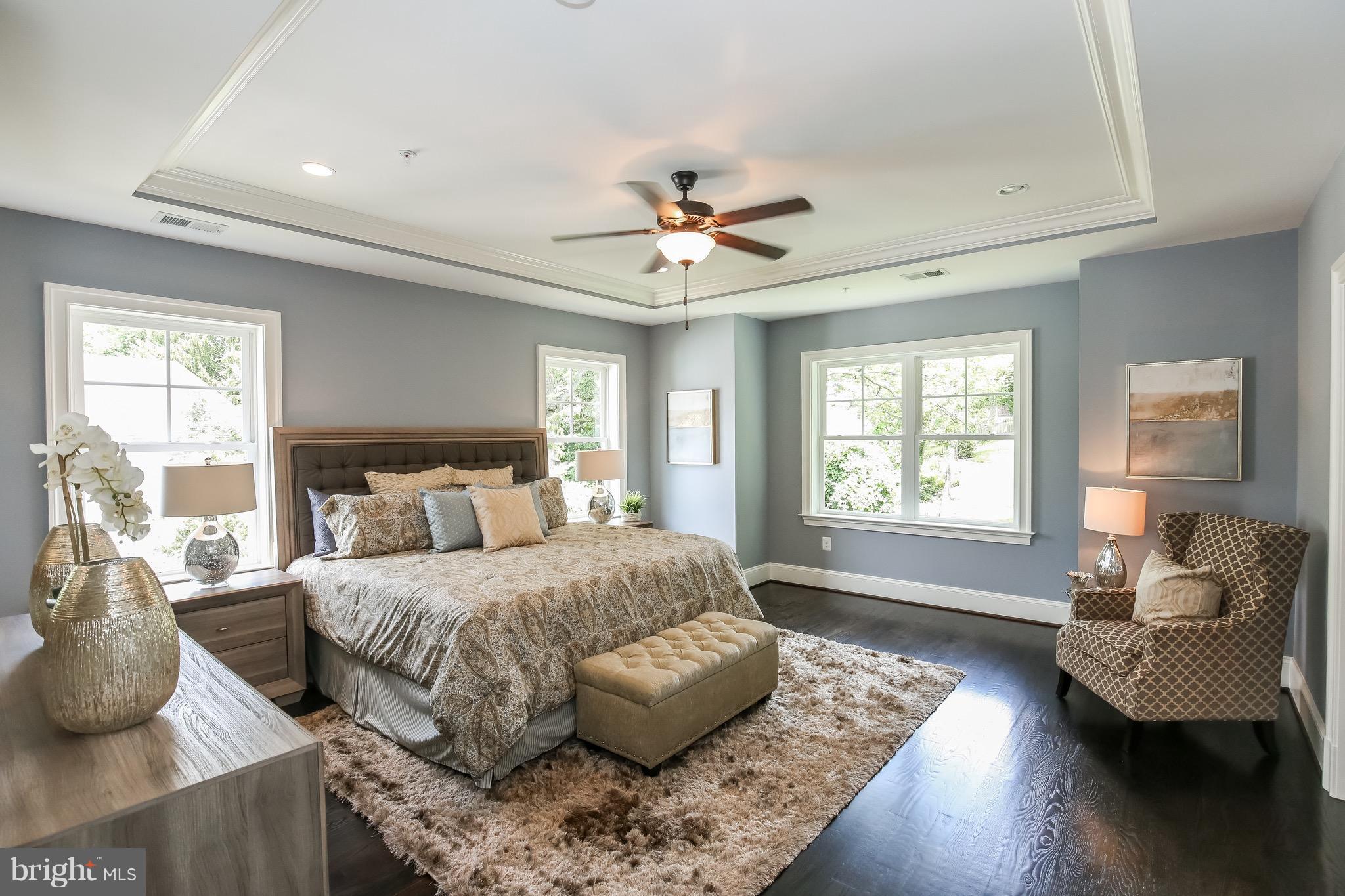 8813 Ridge Road Bethesda, MD 20817 - Photo 13 of 30 a bedroom with a bed couches chair and two large window