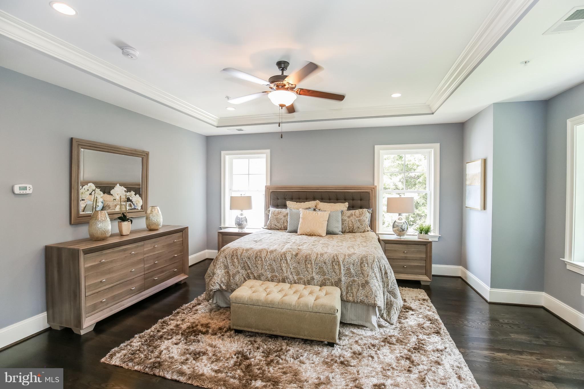 8813 Ridge Road Bethesda, MD 20817 - Photo 14 of 30 a bedroom with a bed and wooden floor