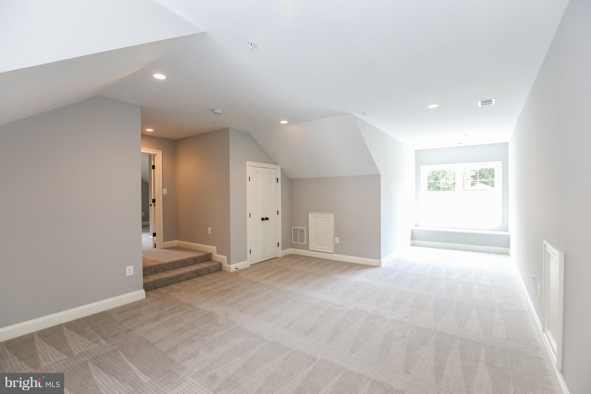 8813 Ridge Road Bethesda, MD 20817 - Photo 19 of 30 an empty room with entrance and windows
