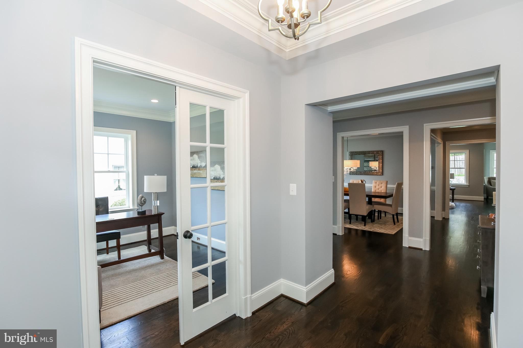 8813 Ridge Road Bethesda, MD 20817 - Photo 3 of 30 a view of a room with wooden floor and furniture