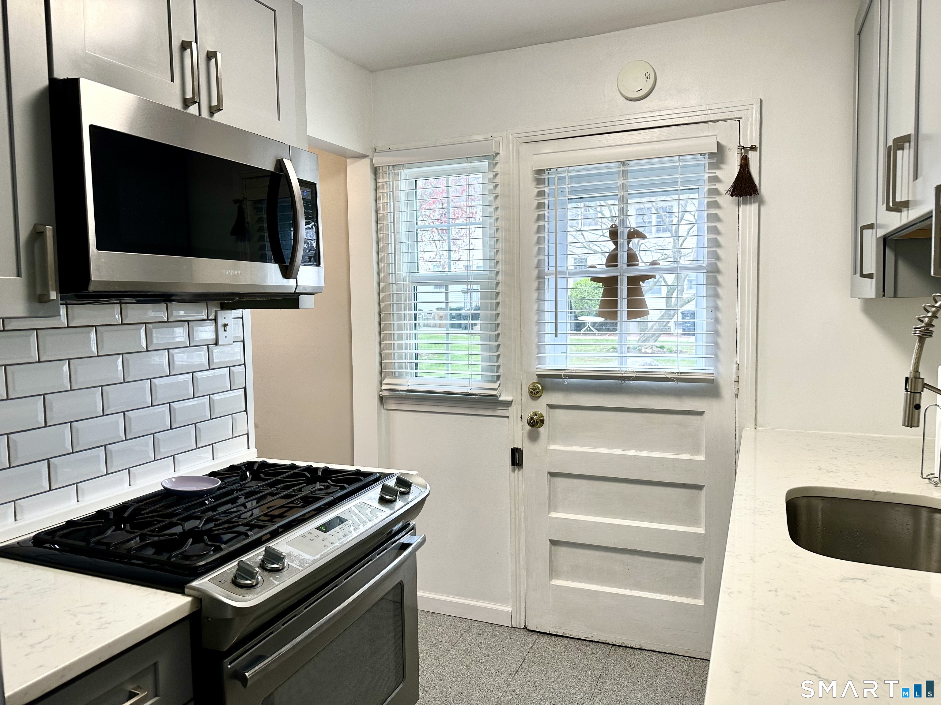 198 Sylvan Knoll Road Stamford, CT 06902 - Photo 6 of 17 a kitchen with a stove and a microwave