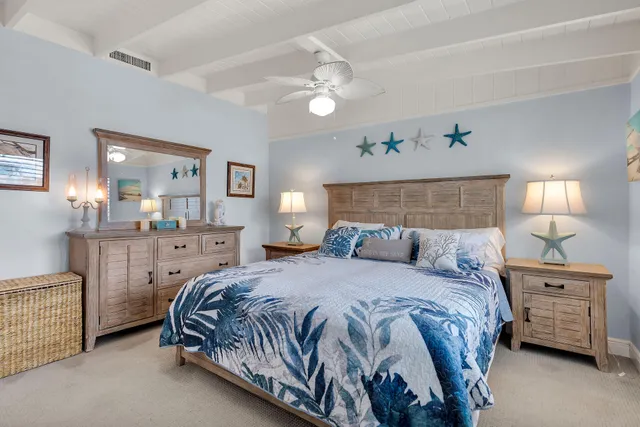 a bedroom with a bed and a mirror