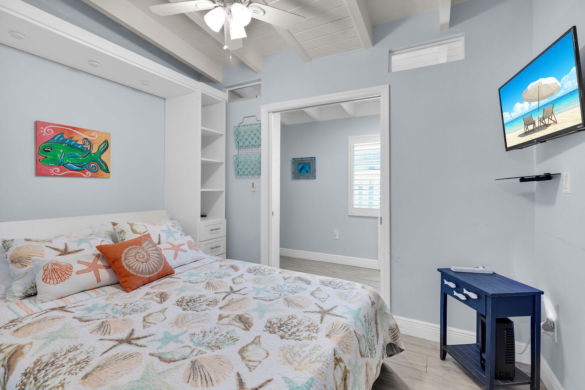 8 Sadowski Key Key Colony Beach, FL 33051 - Photo 16 of 57 a bedroom with a bed and a chandelier