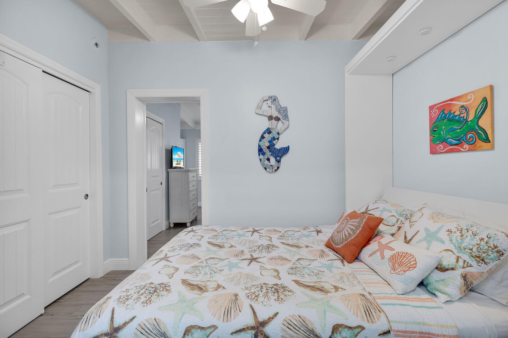 8 Sadowski Key Key Colony Beach, FL 33051 - Photo 17 of 57 a bedroom with a bed and a chandelier