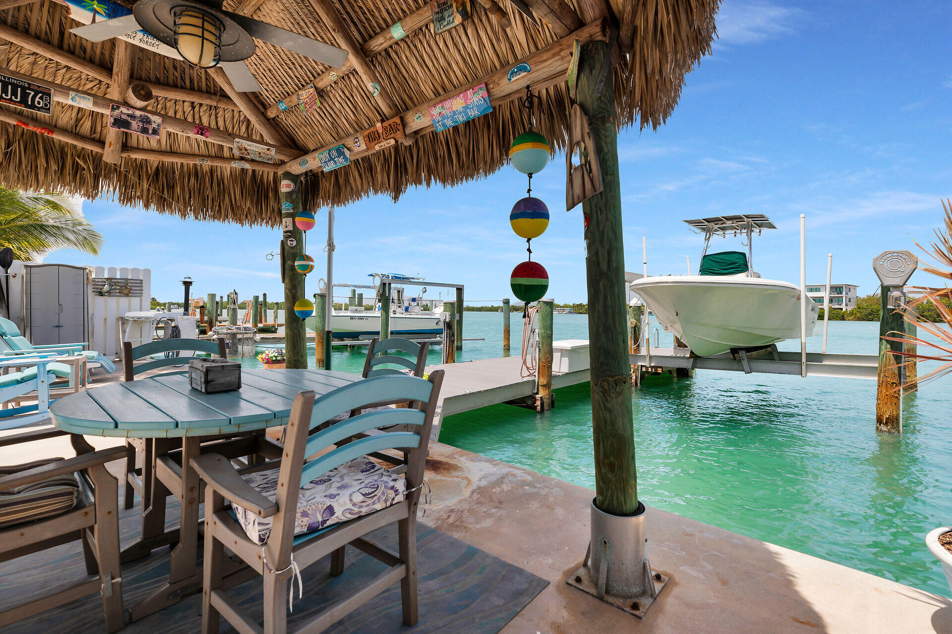 8 Sadowski Key Key Colony Beach, FL 33051 - Photo 29 of 57 a view of a chairs and table in patio with a yard