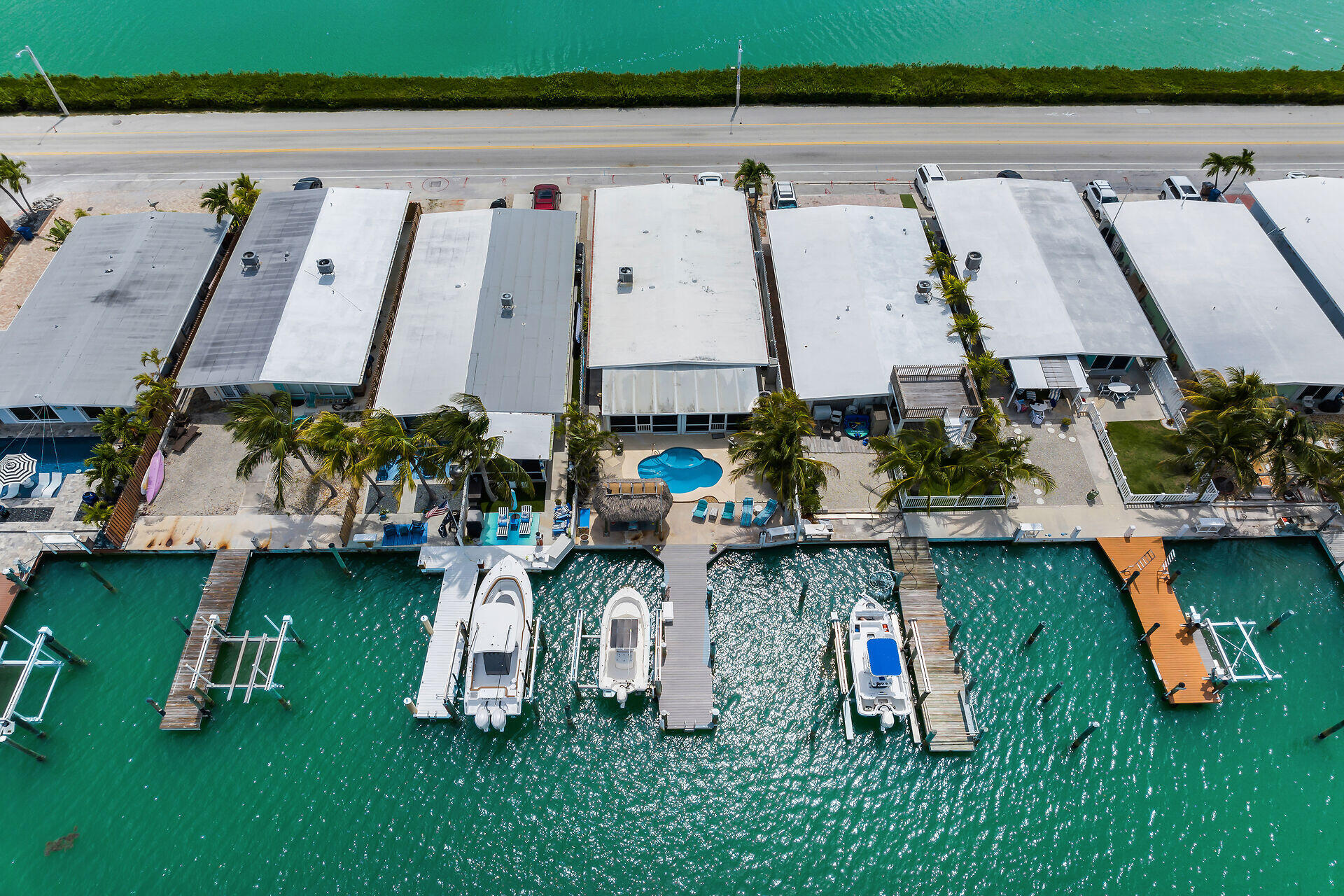 8 Sadowski Key Key Colony Beach, FL 33051 - Photo 33 of 57 an aerial view of a swimming pool with outdoor seating and yard