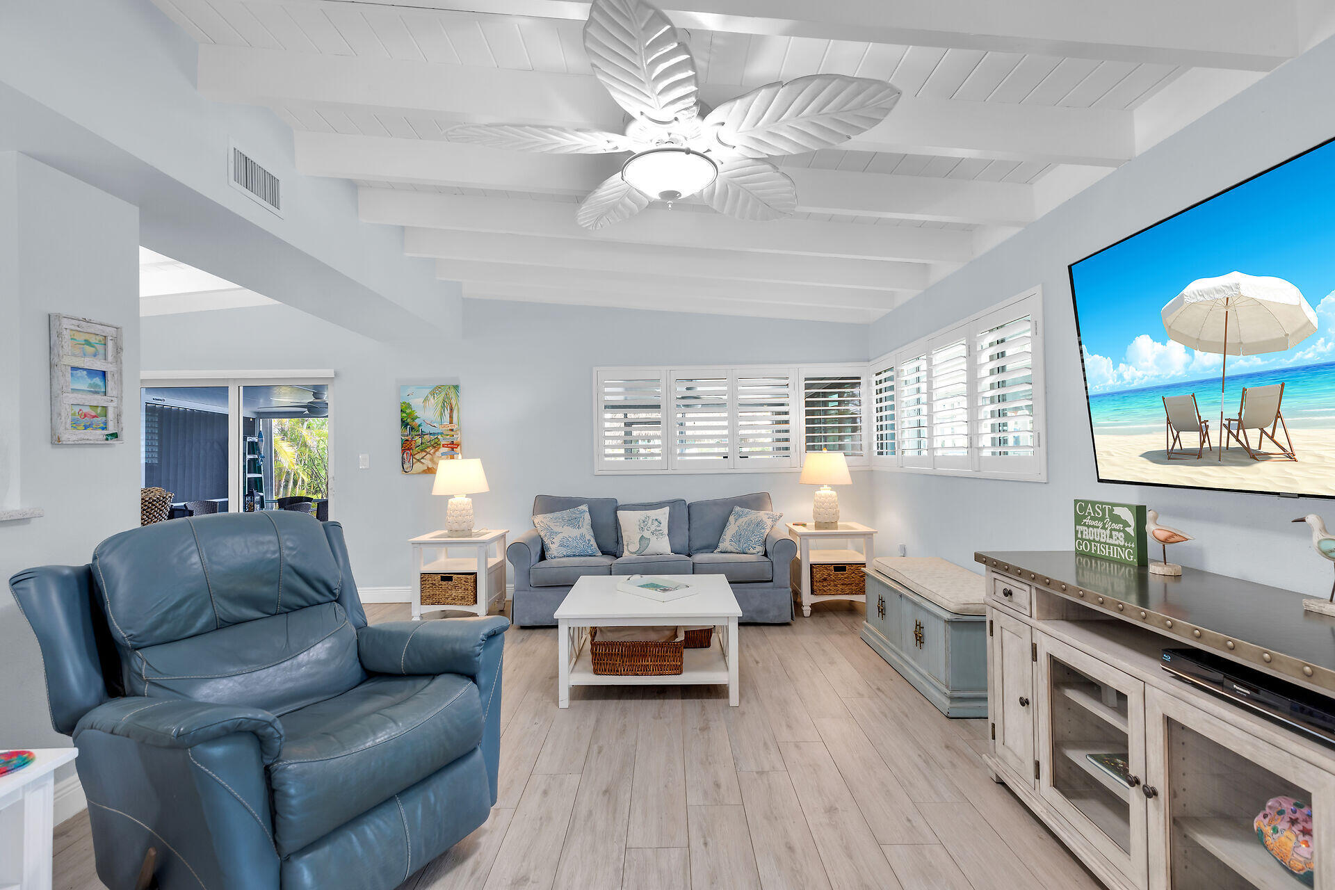 8 Sadowski Key Key Colony Beach, FL 33051 - Photo 5 of 57 a living room with furniture a chandelier and a wooden floor