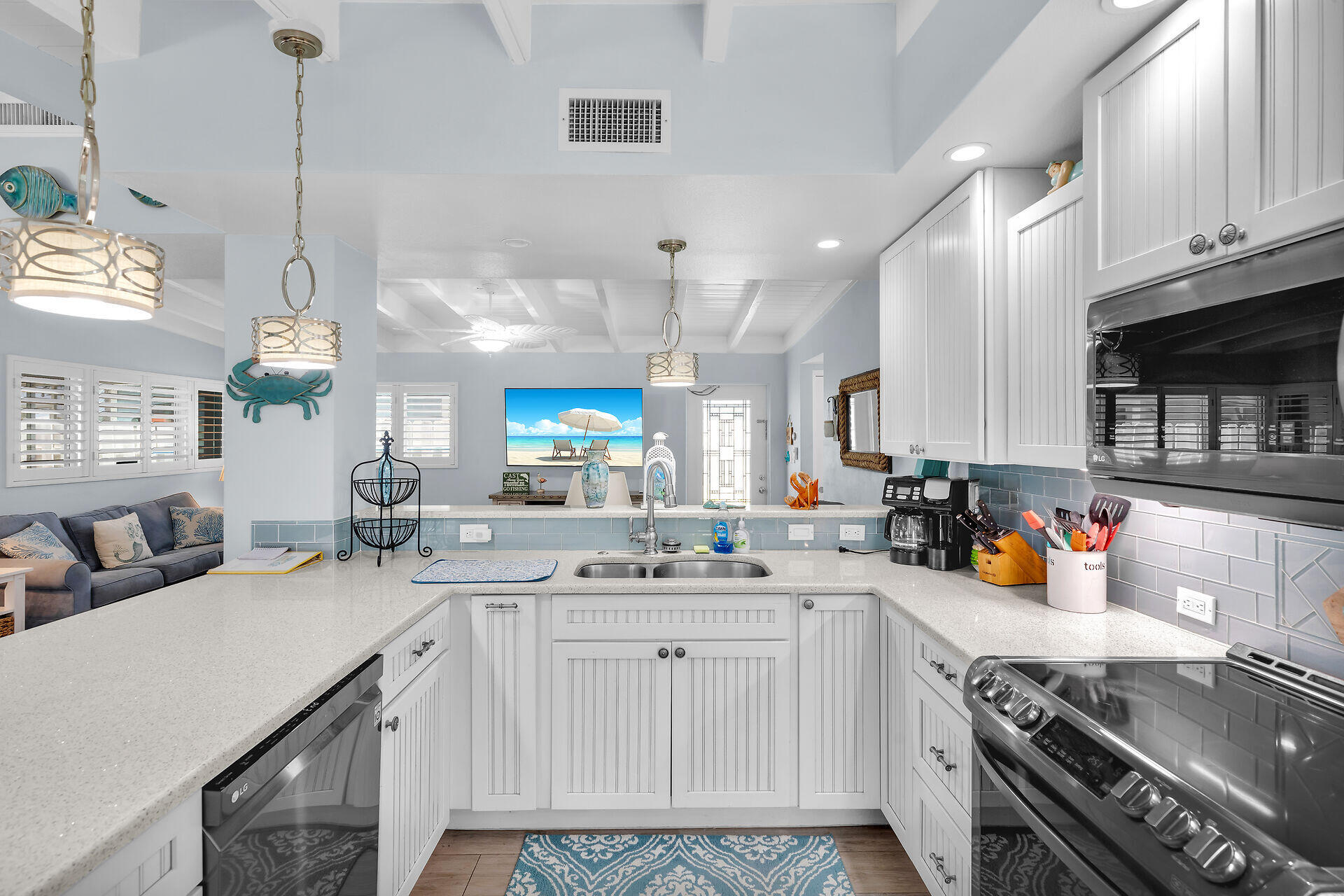 8 Sadowski Key Key Colony Beach, FL 33051 - Photo 10 of 57 a kitchen with a sink a stove and cabinets