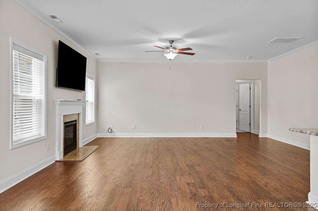 252 School Side Drive Spring Lake, NC 28390 - Photo 11 of 35 a view of empty room with wooden floor and fan