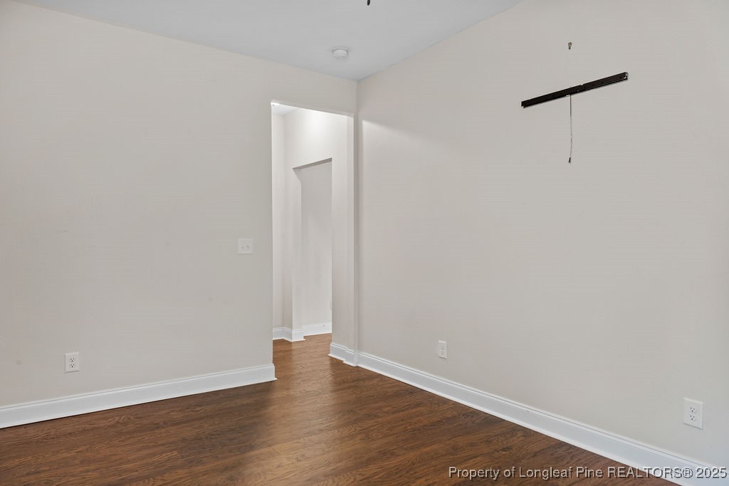 252 School Side Drive Spring Lake, NC 28390 - Photo 13 of 35 a view of an empty room with wooden floor