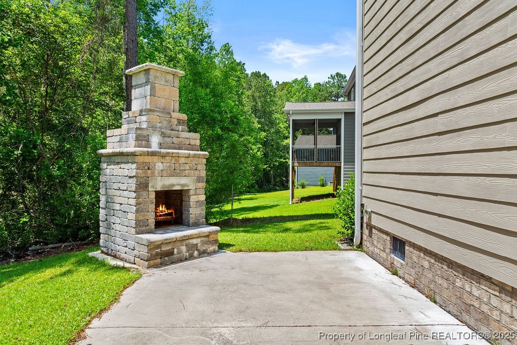 252 School Side Drive Spring Lake, NC 28390 - Photo 30 of 35 a front view of a house with garden