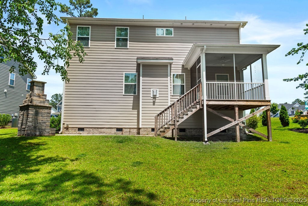 252 School Side Drive Spring Lake, NC 28390 - Photo 32 of 35 a view of a house with wooden fence and a large tree