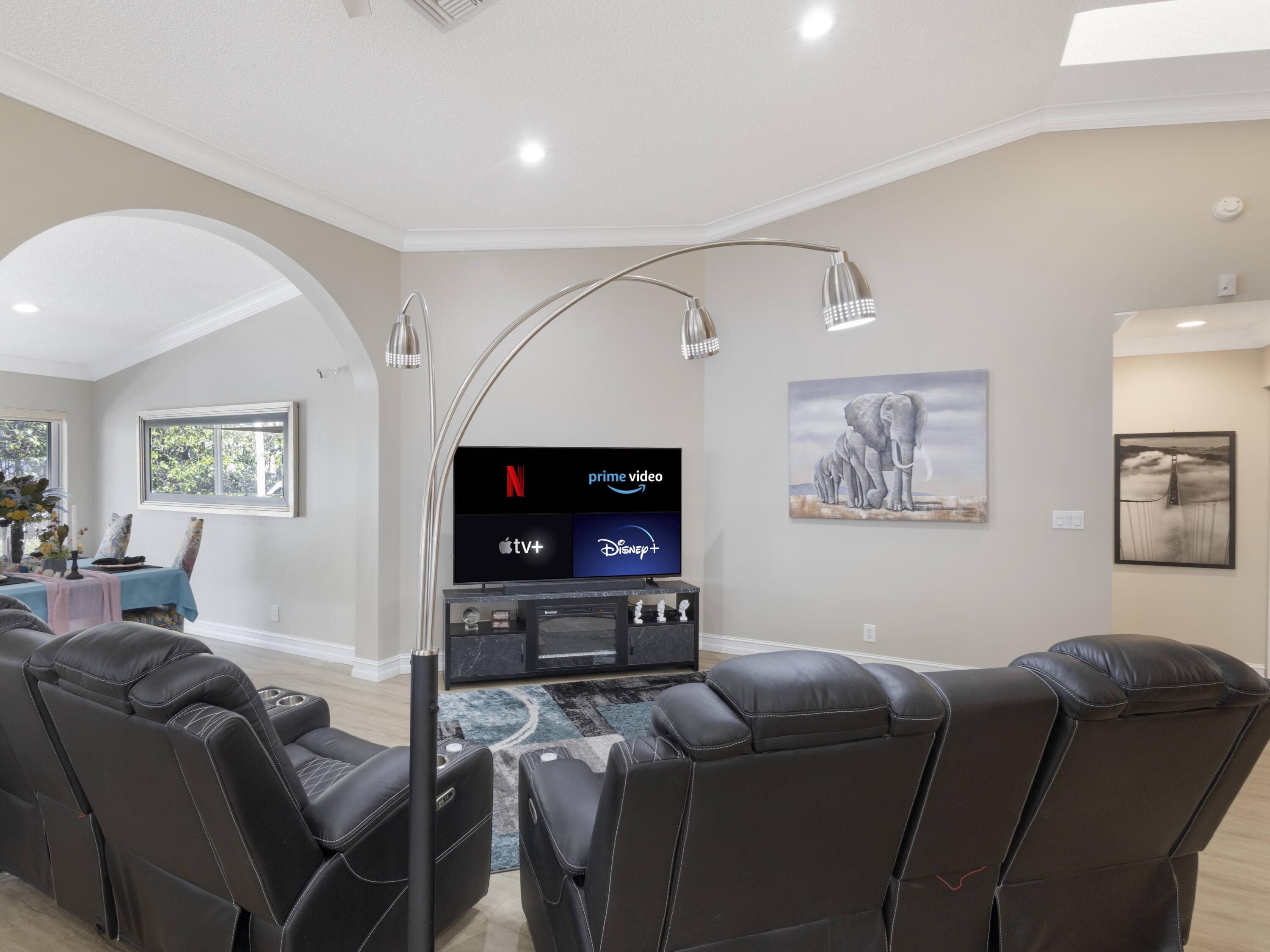 9734 Harbour Lake Circle Boynton Beach, FL 33437 - Photo 12 of 41 a living room with furniture and a flat screen tv