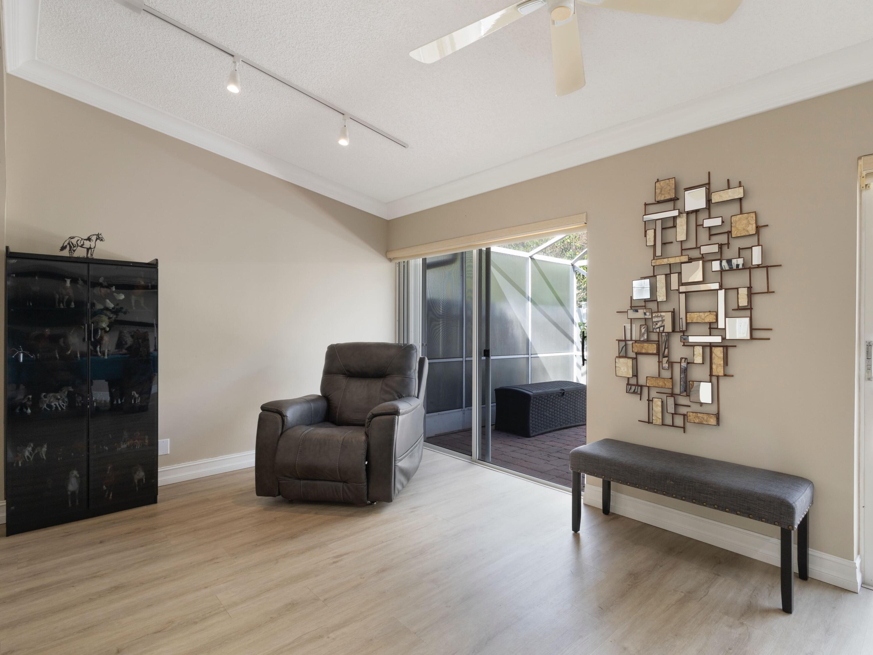9734 Harbour Lake Circle Boynton Beach, FL 33437 - Photo 15 of 41 a living room with furniture and a wooden floor