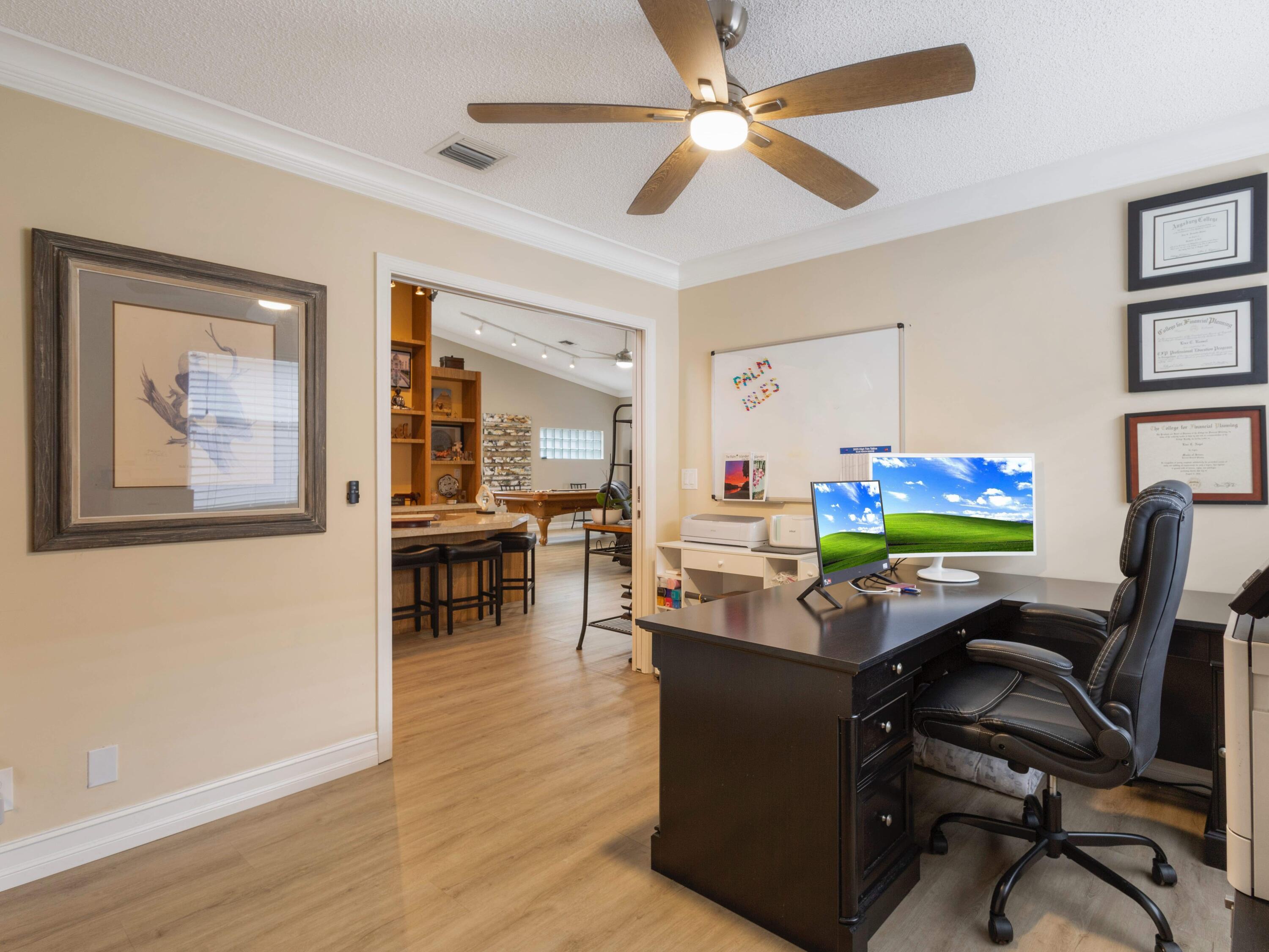 9734 Harbour Lake Circle Boynton Beach, FL 33437 - Photo 19 of 41 a room with furniture and a flat screen tv