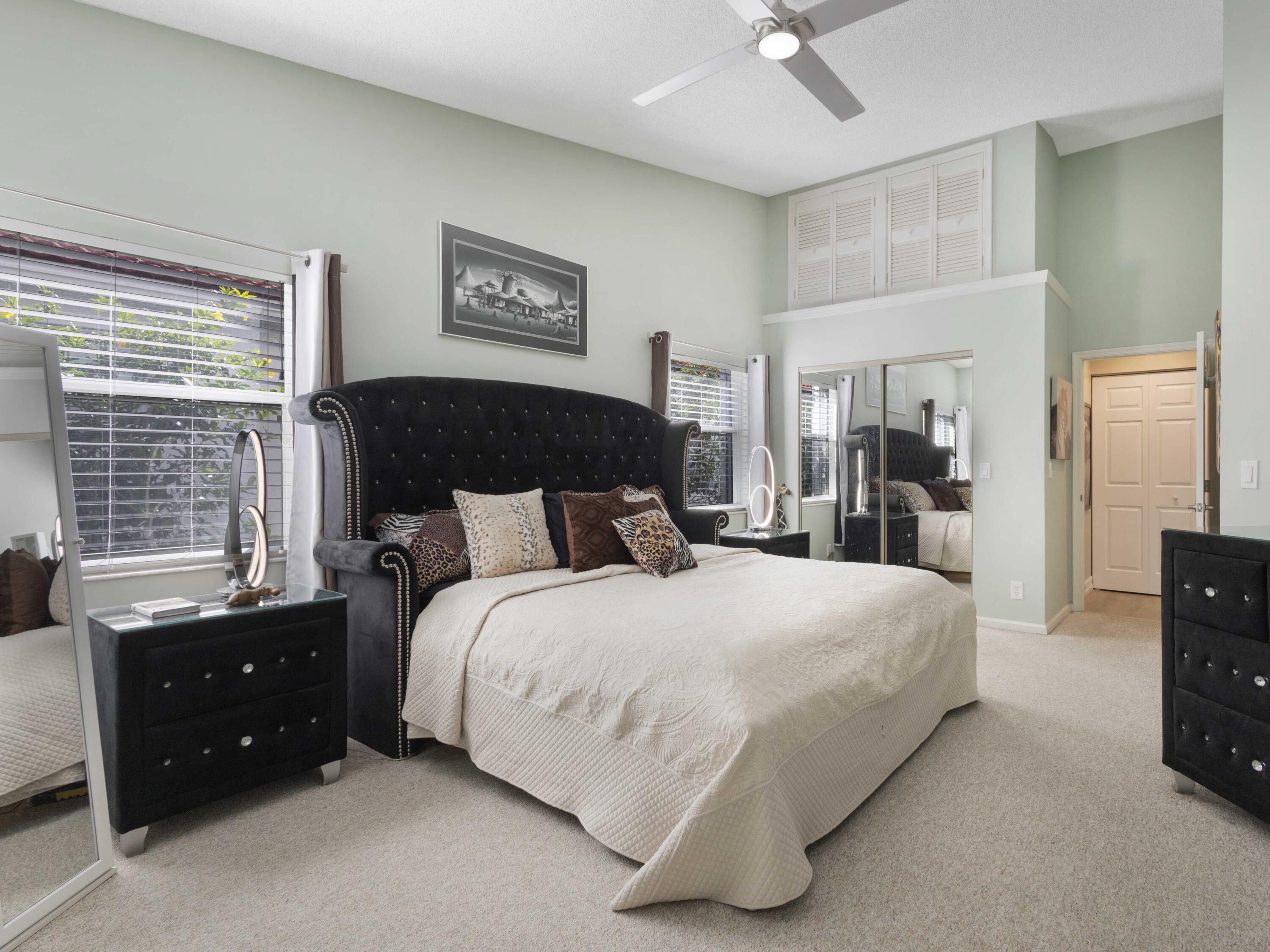 9734 Harbour Lake Circle Boynton Beach, FL 33437 - Photo 24 of 41 a bedroom with a bed and a tv