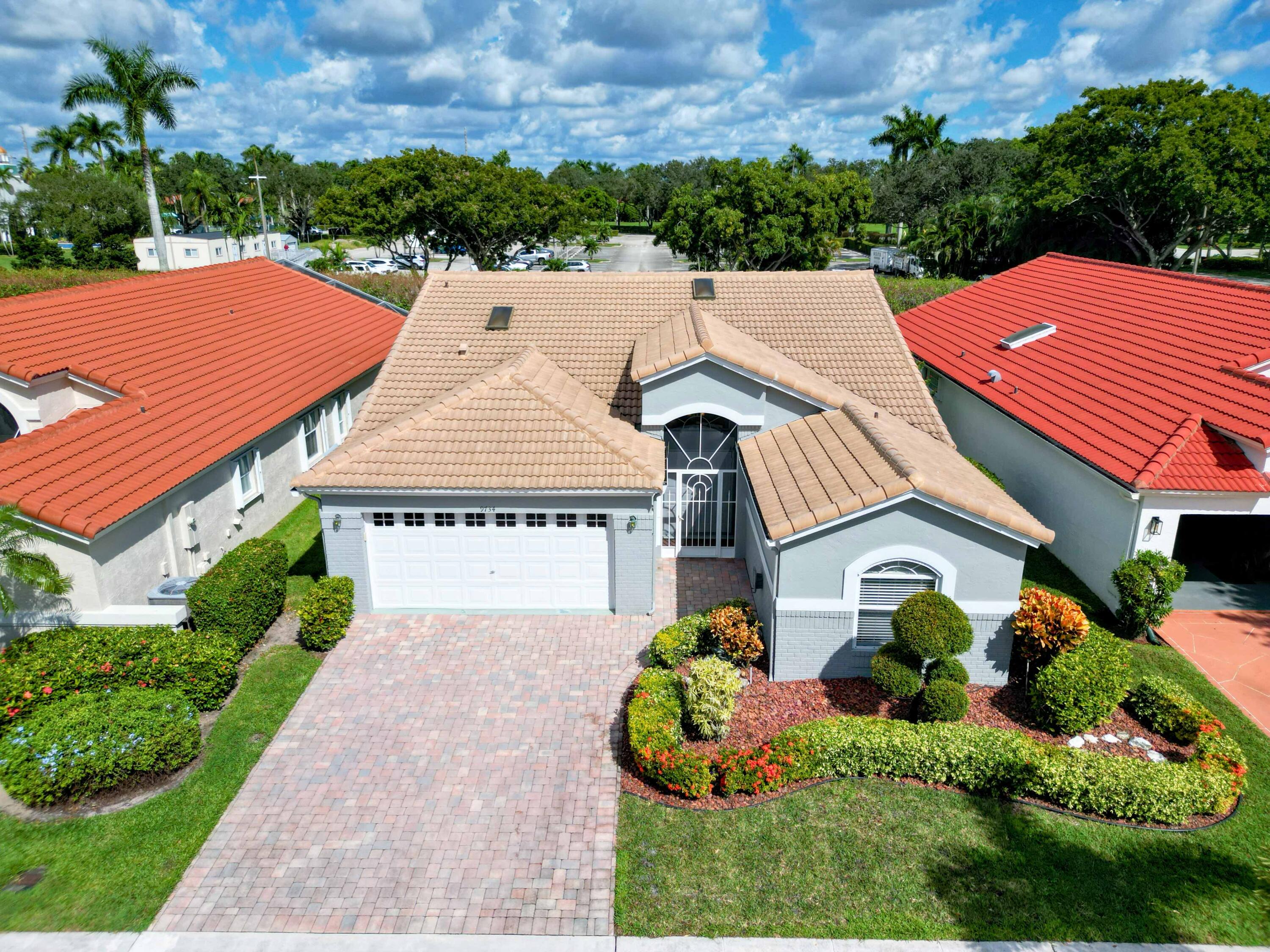 9734 Harbour Lake Circle Boynton Beach, FL 33437 - Photo 29 of 41 a view of a house with a yard and potted plants