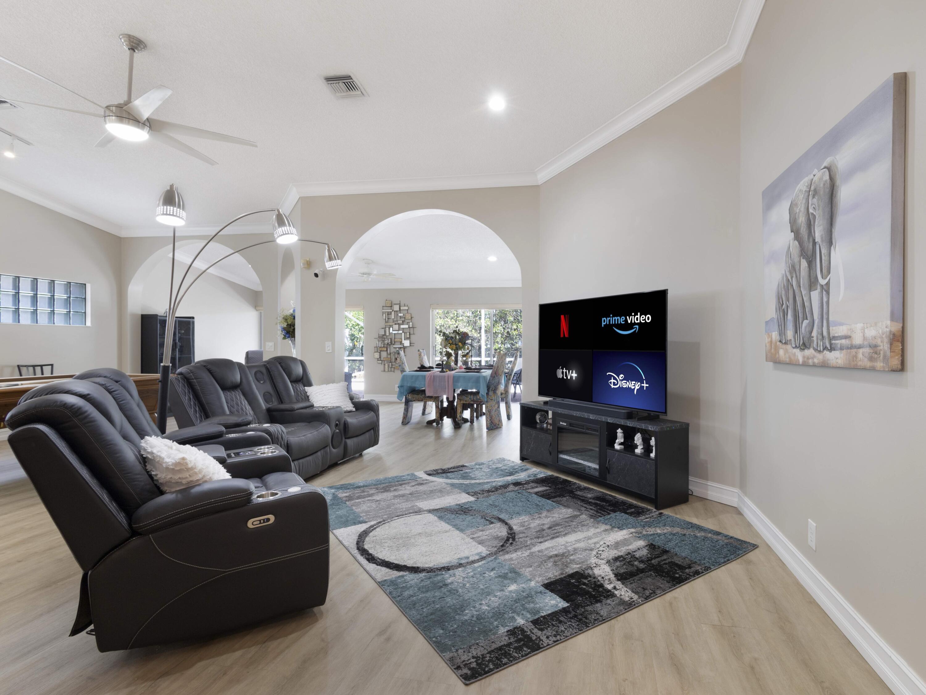 9734 Harbour Lake Circle Boynton Beach, FL 33437 - Photo 10 of 41 a living room with furniture and a flat screen tv