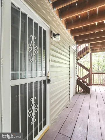 a view of a balcony with wooden floor