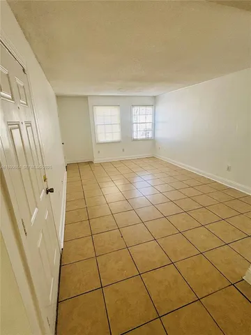 a view of a livingroom and a window