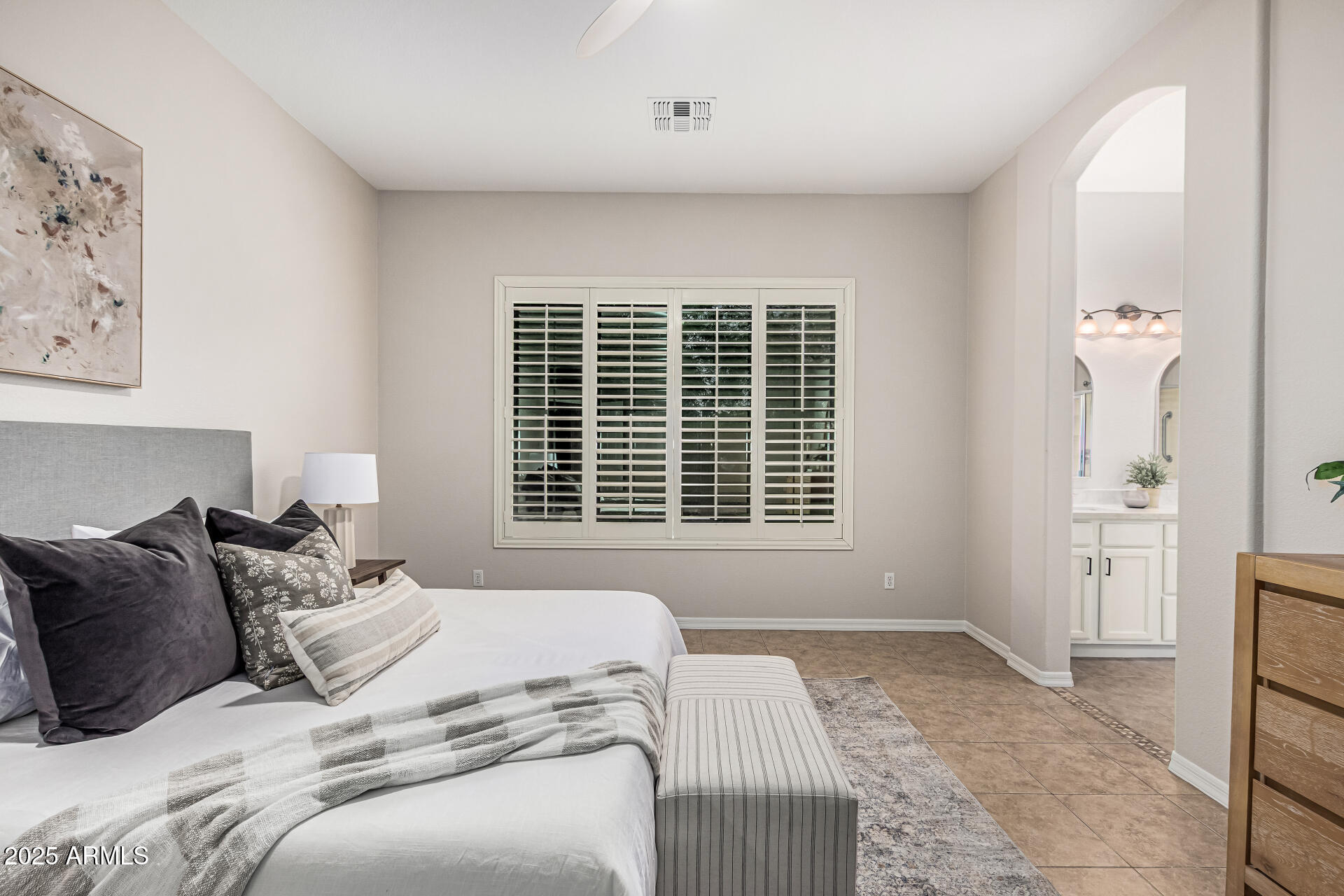 5035 South Ranger Trail Gilbert, AZ 85298 - Photo 14 of 64 a bed sitting in a bedroom next to a window