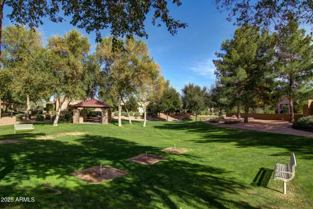 a view of a terrace with couches and wooden fence