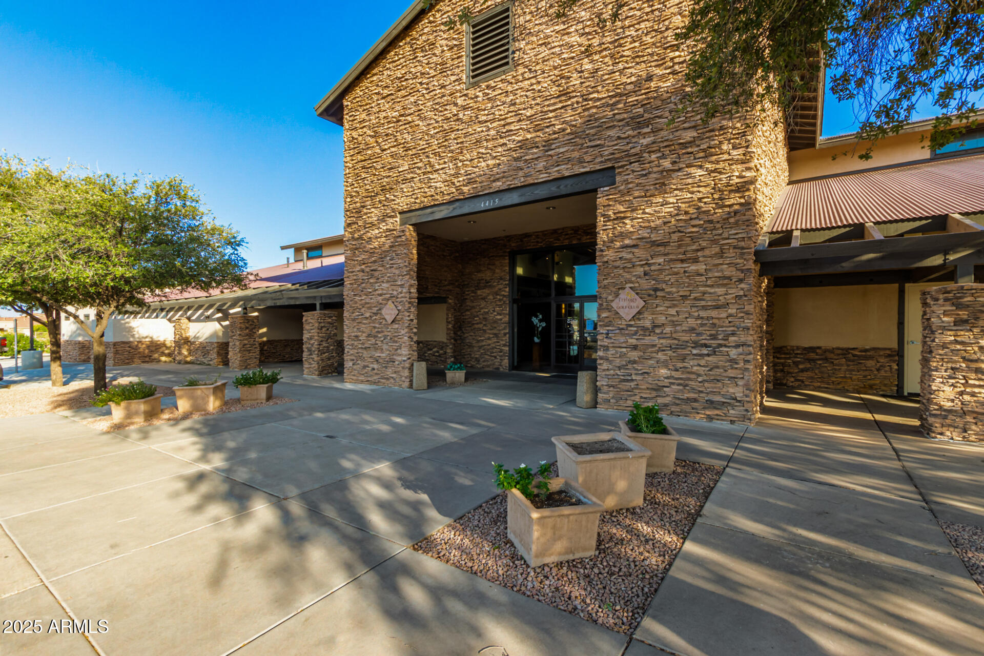 5035 South Ranger Trail Gilbert, AZ 85298 - Photo 56 of 64 a view of a brick house with an outdoor space